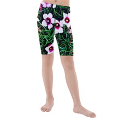 Pink Flowers Over A Green Grass Kids  Mid Length Swim Shorts by DanaeStudio