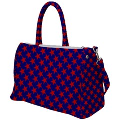 Red Stars Pattern On Blue Duffel Travel Bag by BrightVibesDesign