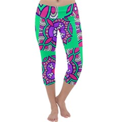 Purple Shapes On A Green Background                          Capri Yoga Leggings by LalyLauraFLM