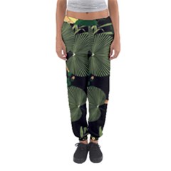 Tropical vintage yellow hibiscus floral green leaves seamless pattern black background. Women s Jogger Sweatpants