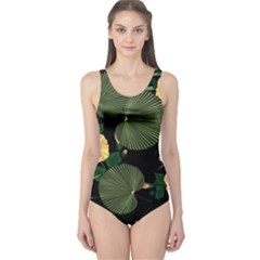 Tropical vintage yellow hibiscus floral green leaves seamless pattern black background. One Piece Swimsuit