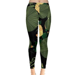 Tropical vintage yellow hibiscus floral green leaves seamless pattern black background. Inside Out Leggings