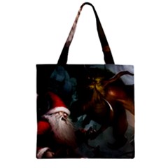 A Santa Claus Standing In Front Of A Dragon Zipper Grocery Tote Bag by bobilostore