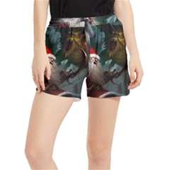 A Santa Claus Standing In Front Of A Dragon Low Women s Runner Shorts by EmporiumofGoods