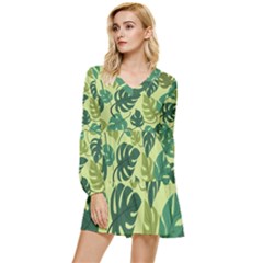 Seamless Pattern Of Monstera Leaves For The Tropical Plant Background Tiered Long Sleeve Mini Dress by Grandong