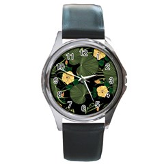 Tropical vintage yellow hibiscus floral green leaves seamless pattern black background. Round Metal Watch