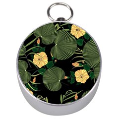 Tropical vintage yellow hibiscus floral green leaves seamless pattern black background. Silver Compasses