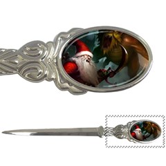 A Santa Claus Standing In Front Of A Dragon Letter Opener by bobilostore